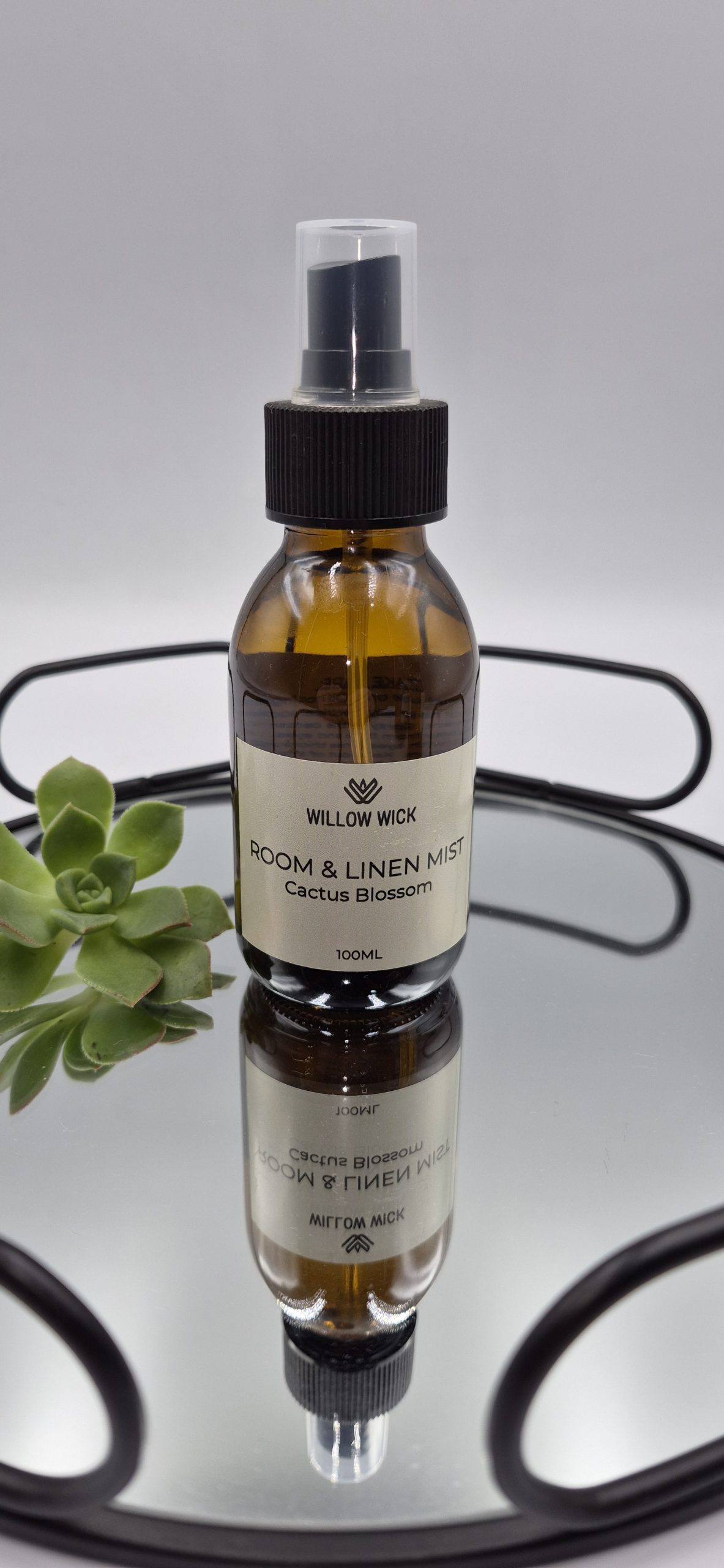 Willow Wick Cactus Blossom Room and Linen Mist in a 100ml amber glass bottle for refreshing rooms, bedding and linen.